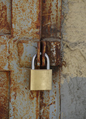 old rusty lock with new lock