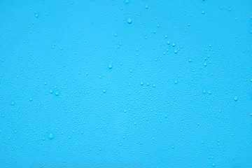 water drop on blue plastic texture