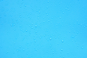 water drop on blue plastic texture