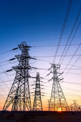 Fototapeta premium In the evening, the outline of the transmission tower