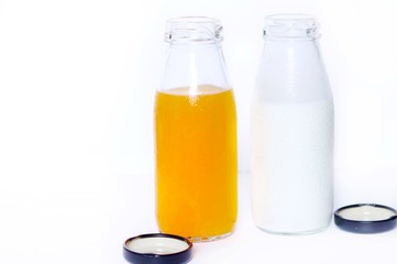 The Orange juice bottle and milk bottle isolated on white background