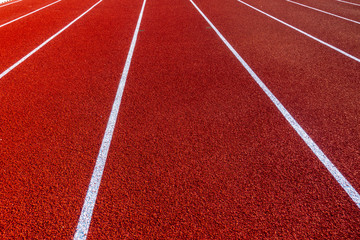 Red running track in stadium