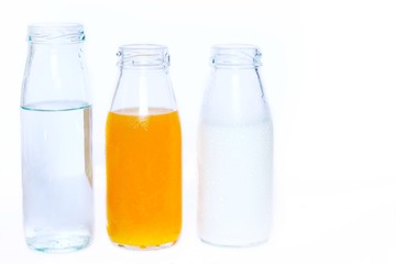 The set of bottles of orange juice,milk and drink water isolated on white background , Healthy concept