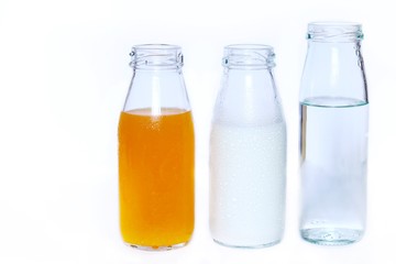 The set of bottles of orange juice,milk and drink water isolated on white background , Healthy concept
