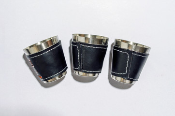 metal cups on white background