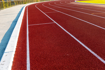 Red running track in stadium