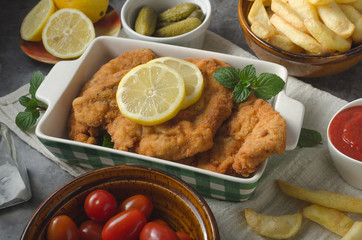 Homemade german schnitzel with pickles