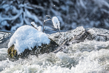 snowed rock in river isar