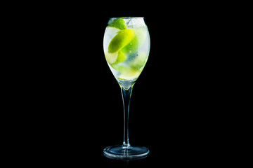 Royal mojito cocktail lime and mint isolated on black background. Selective focus. Shallow depth of field.