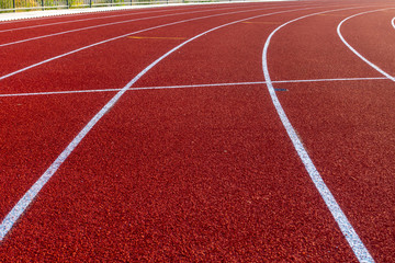 Red running track in stadium