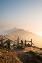 Stunning Winter sunrise landscape image of The Great Ridge in the Peak District in England with a...