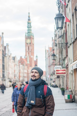 Young man walking in the old historical European city