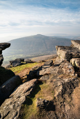 Stunning Winter landscape image of the Peak District in England viewed from Bamford Edge with Lose...