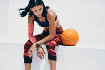 Female athlete taking a break from workout