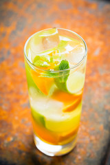 Mandarine mojito cocktail lime and mint. Selective focus. Shallow depth of field.