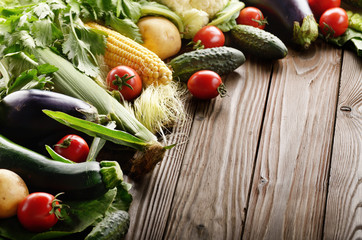 Fresh Organic Vegetable Food Ingredients on Wooden kitchen table background. Space for text.