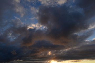 dark sky in the sunlight at sunset from storm clouds colors  nature background