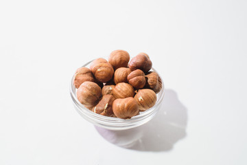 Fototapeta na wymiar The top view of hazelnuts isolated on white background