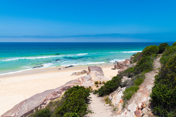 View over remote Quondolo Beach, located in Ben Boyd National Park, NSW, Australia, popular for surfing and rockpool exploring and subject to rips tides and big waves