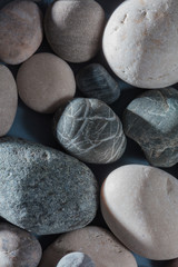 Stones collection. Different kind of pebbles stones with a soft shadow against white background.