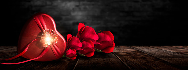 Romantic background with flowers, red roses and a box, a heart-shaped box. Night lanterns, the magical atmosphere of the evening. The scenery is romance. Love stories for women. Night view. - Powered by Adobe