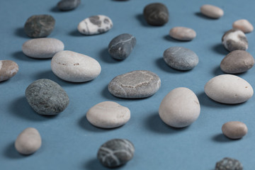 Fototapeta na wymiar Stones collection. Different kind of pebbles stones with a soft shadow against white background.