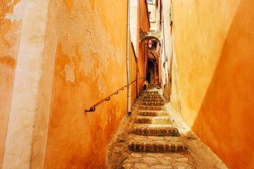 France Provence Roussillon narrow deserted street. Stone steps up. - obrazy, fototapety, plakaty