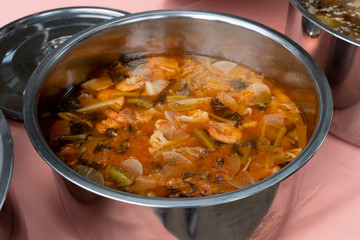 Thai food Hot sour soup with shrimp and radish in a pot container.