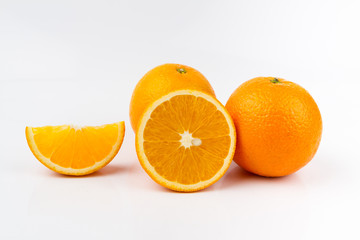 Ripe orange fruit on white background. Round orange slice.