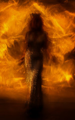 the silhouette of the queen on fire