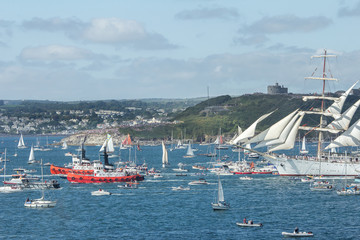 Tugs guide Tall Ship to Sea at the Tall Ships Festival, Falmouth, Cornwall