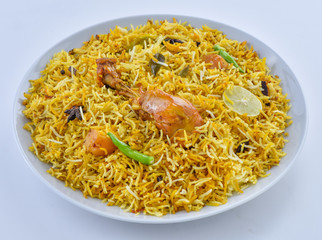 Chicken Biryani, a yummy & fluffy rice dish with spicy savory chicken pieces with salad.