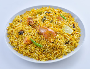 Chicken Biryani, a yummy & fluffy rice dish with spicy savory chicken pieces with salad.
