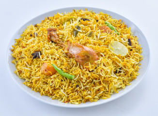 Chicken Biryani, a yummy & fluffy rice dish with spicy savory chicken pieces with salad.