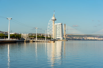 The Vasco da Gama tower and the Vasco da Gama cable-stayed bridge in the new district Park of the Nations in north of Lisbon