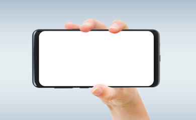 Woman hand holding smartphone mockup isolated on grey