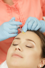Beautiful woman getting beauty injections at the beauty salon