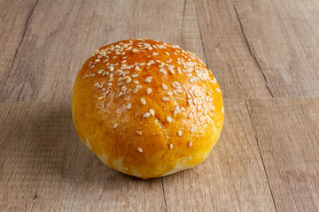 burger rolls on a light wooden background