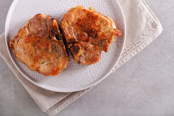 Fried pork steaks on plate