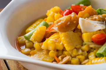 thai style spicy salad with yellow corn.