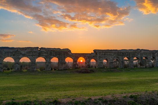 Rome (Italy) - The Parco degli Acquedotti at sunset, an archeological public park in Rome, part of the Appian Way Regional Park, with monumental ruins of roman aqueducts.