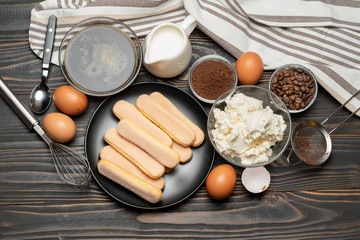 Ingredients for traditional tiramisu cake on wooden background