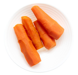 Boiled carrots in a plate on a white background