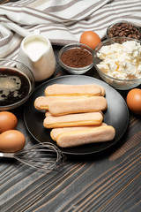 Ingredients for traditional tiramisu cake on wooden background