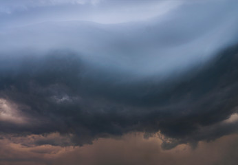 Scary epic sky with menacing clouds. Hurricane wind with a thunderstorm. Stock background, photo