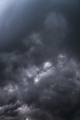 Scary epic sky with menacing clouds. Hurricane wind with a thunderstorm. Stock background, photo
