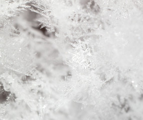 White snowflakes on nature as a background