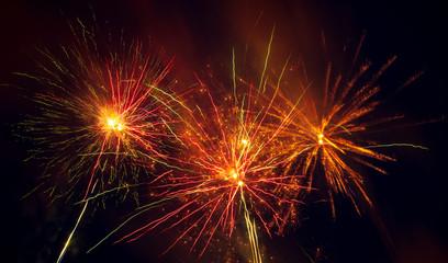 Fototapeta na wymiar Fireworks in the sky at night as a background