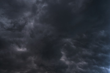 Scary epic sky with menacing clouds. Hurricane wind with a thunderstorm. Stock background, photo