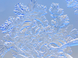Snow patterns on glass as an abstract background